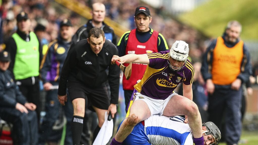 Wexford’s Liam Ryan attempts to gather the ball under pressure from Waterford’s Maurice Shanahan during their Allianz League clash. Photo: ken Sutton/Inpho