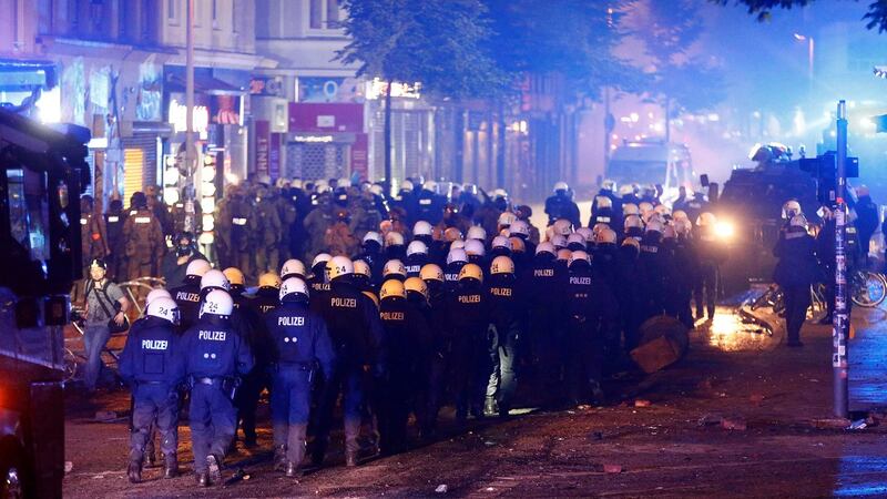 German police walk in line during demonstrations at the G20 summit in Hamburg, Germany. Photograph:  REUTERS/Hannibal Hanschke