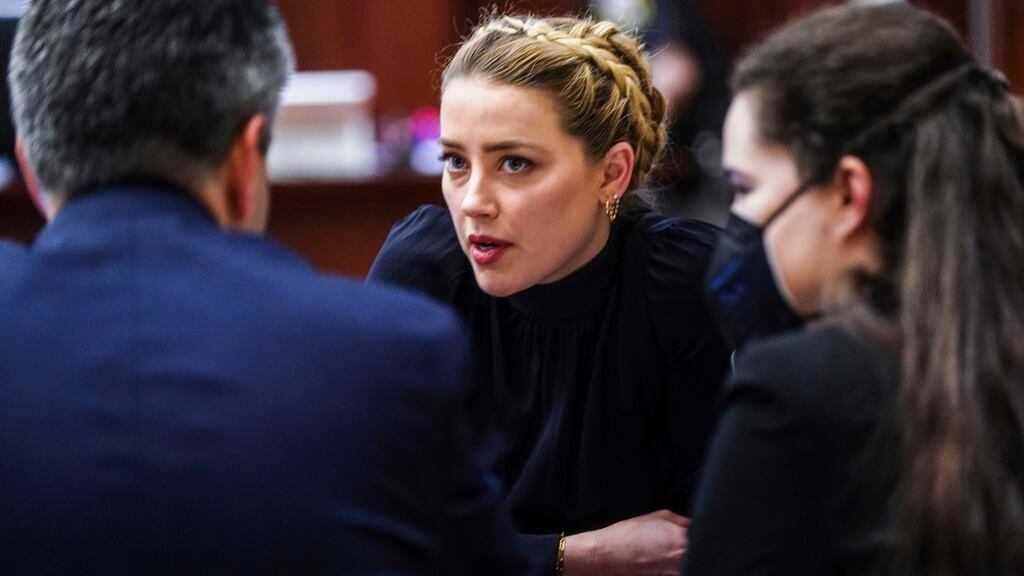 Actress Amber Heard talks with attorneys in the courtroom at the Fairfax County Circuit Courthouse on Thursday. Photograph: Shawn Thew/AP