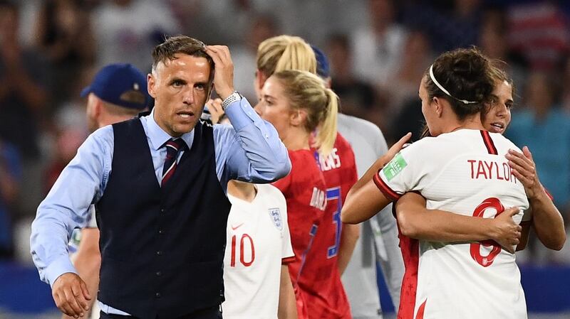 Phil Neville leaves the pitch at the final whistle. Photo: Franck Fife/Getty Images