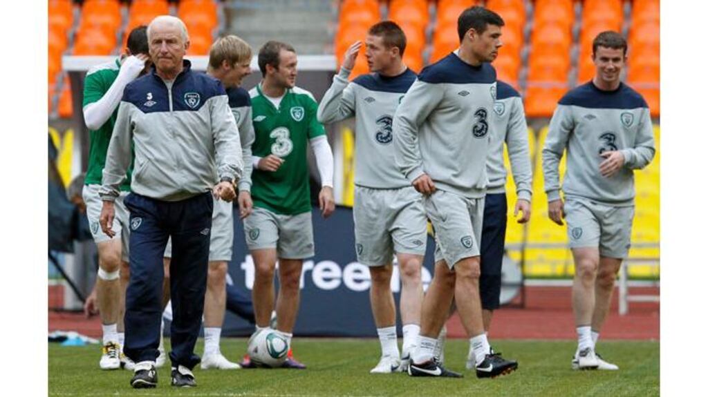 Giovanni Trapattoni (left) and his players attend a training session at the Luzhniki stadium in Moscow today - (Photograph: Denis Sinyakov/Reuters)