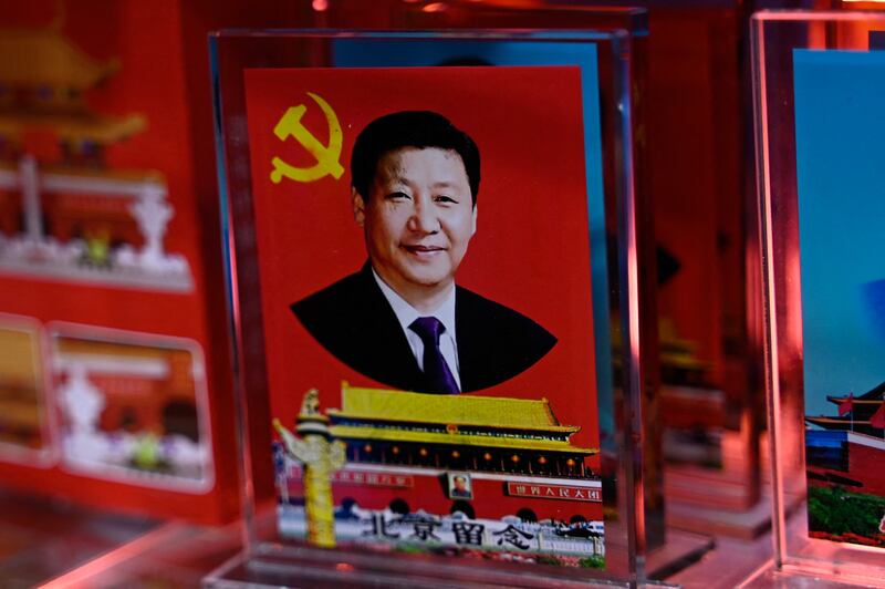 A portrait of Chinese president Xi Jinping at a souvenir shop in Beijing. Photograph: Pedro Pardo/Getty