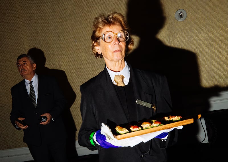 A caterer brings out appetisers at the luncheon in Beverly Hills. Photograph: Roger Kisby/The New York Times