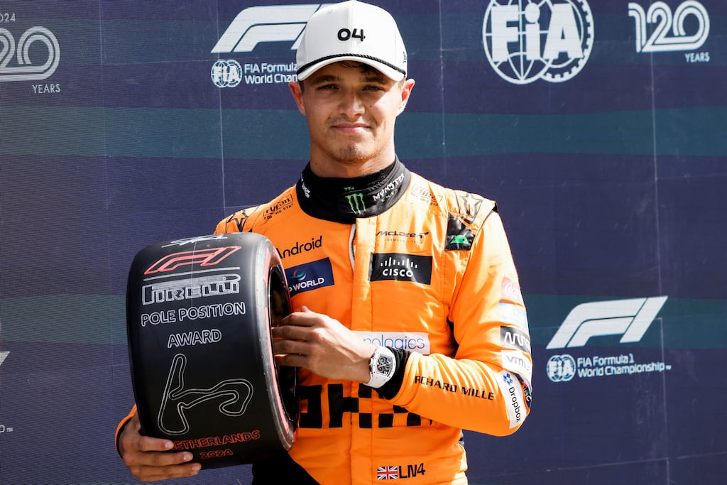 Lando Norris poses with his pole position award at the end of the qualifying session for the Dutch Grand Prix in Zandvoort. Photograph: Simon Wohlfahrt/AFP via Getty Images
