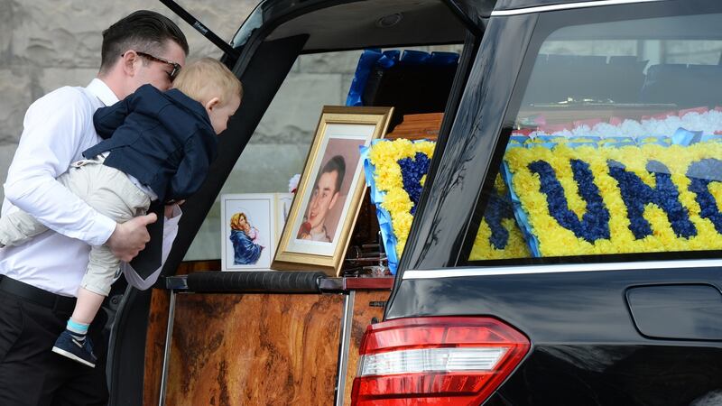 Family members pay their respects at the funeral of Martin O’ Rourke at St Michan’s Church in Dublin. Photograph: Cyril Byrne/The Irish Times