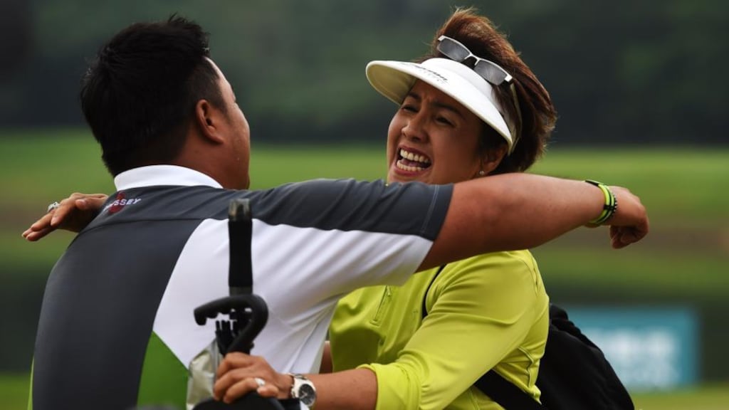 Kiradech Aphibarnrat of Thailand celebrates winning with his mother after a play-off against Li Hao-tong of China in the Shenzhen International at Genzon Golf Club. Photo: Stuart Franklin/Getty Images