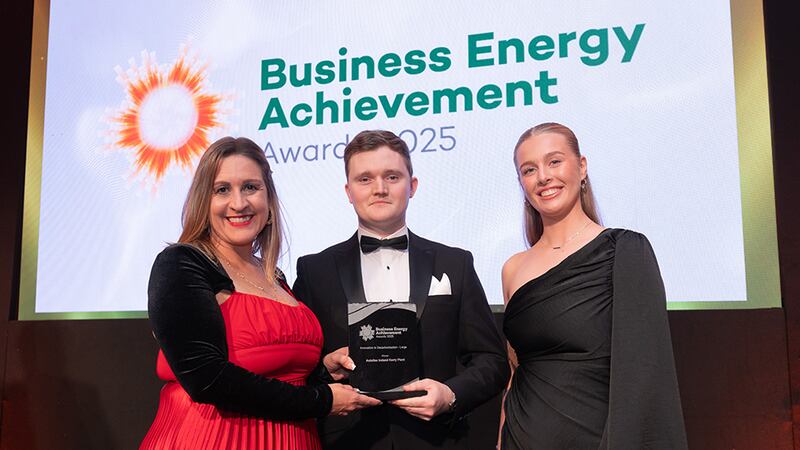 Katherine Valery, awards judge, presents the innovation in decarbonisation - large to Daniel Walsh and Shannon Foster, Astellas Ireland Kerry Plant