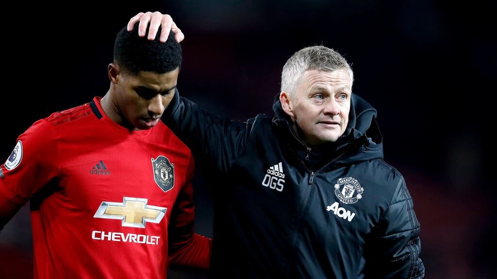 Manchester United manager Ole Gunnar Solskjaer with Marcus Rashford after the final whistle during the Premier League draw with Aston Villa at Old Trafford. Photo: Martin Rickett/PA Wire