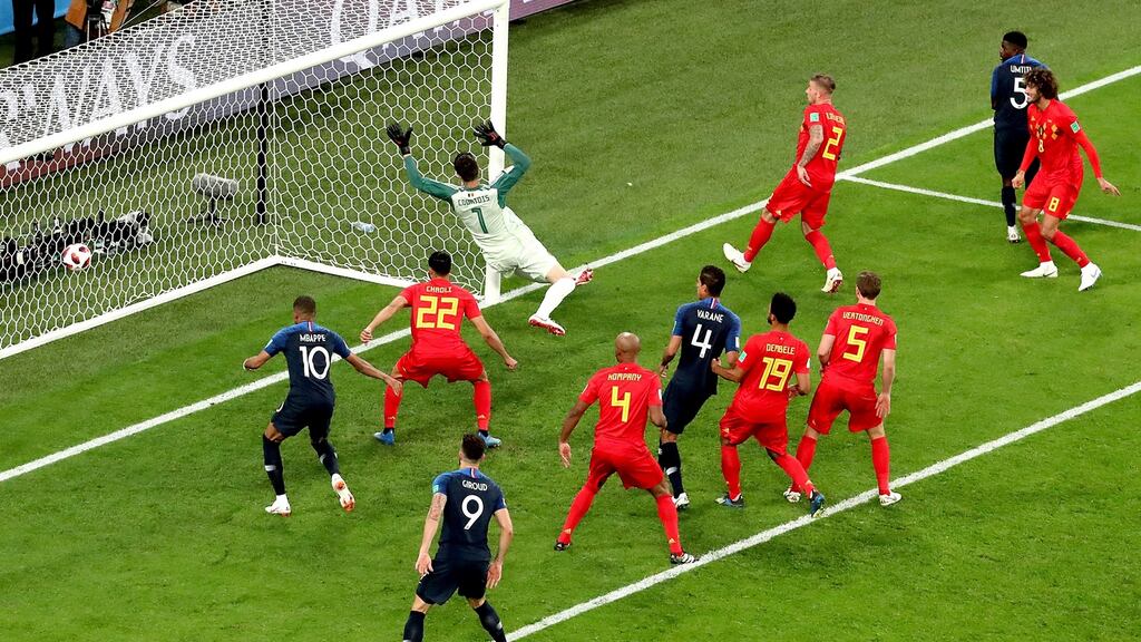 Samuel Umtiti of France scores during their 2018 World Cup semi-final clash with Belgium in St Petersburg. Photo: Zurab Kurtsikidze/EPA