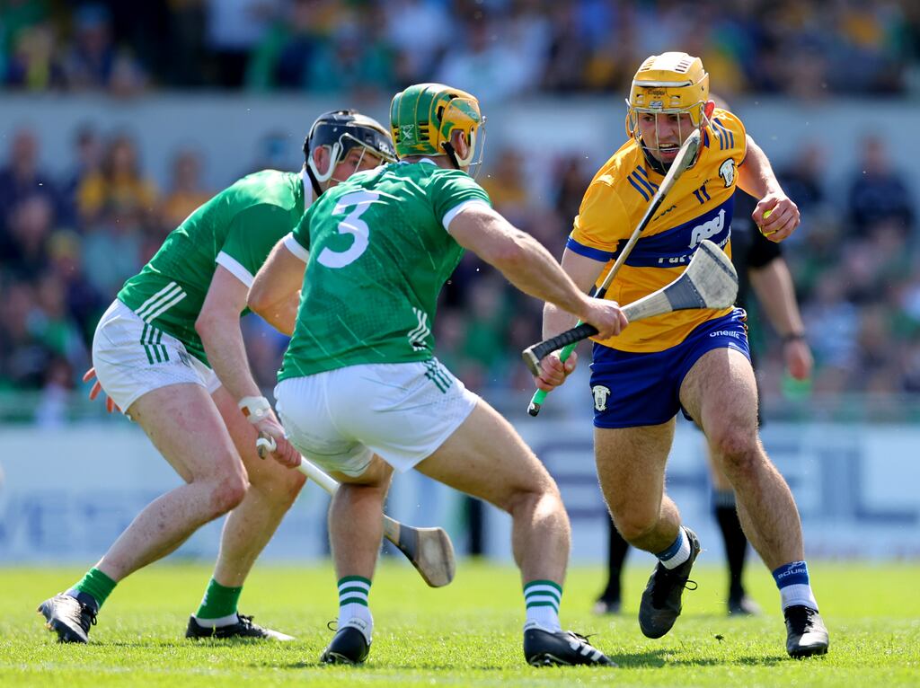Limerick’s Declan Hannon and Dan Morrissey attempt to close down Mark Rodgers of Clare. Photograph: James Crombie/Inpho