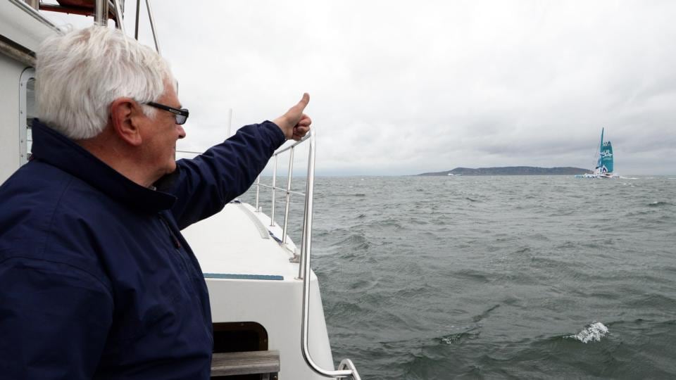 World sailing Speed Record Council commissioner Chris Moore of the National Yacht Club Dun Laoghaire signals to Musandam–Oman Sail on breaking the 20-year-old Round Ireland record. Photograph: Eric Luke