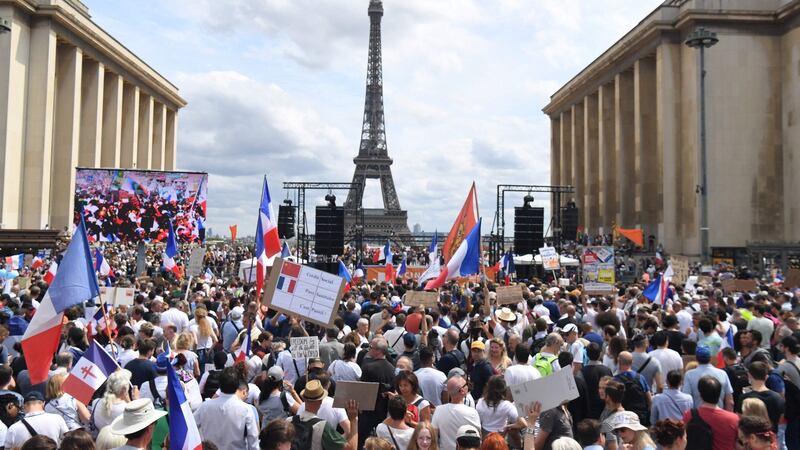 A protest against the compulsory vaccination for certain workers and the mandatory use of the health pass in front of the Eiffel Tower in Paris. Photograph: Alain Jocard/AFP via Getty Images