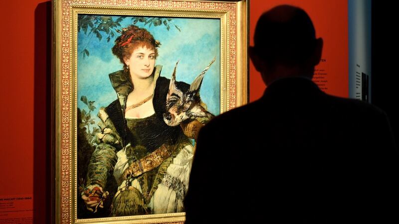 A visitor looks at “The Falconer” by Austrian artist Hans Makart (1840-1884), on display in the Gurlitt exhibition. Photograph: Sascha Steinbach/EPA