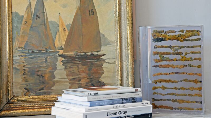 Pamela Drew painting with a resin book, alongside   Sasha’s art books.  Photograph: Eric Luke