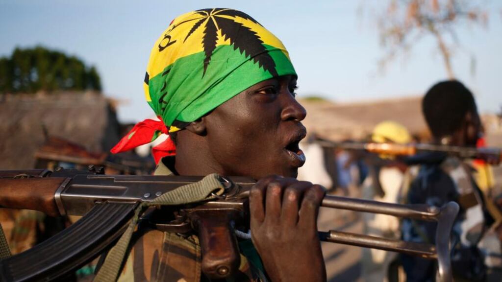 Rebel fighters hold their weapons as they march yesterday in a village in the rebel-controlled territory of Upper Nile state in South Sudan. Photograph: Reuters/Goran Tomasevic