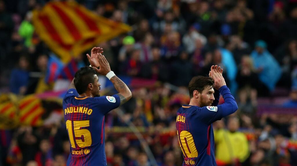 Barcelona’s Paulinho and Lionel Messi celebrate after the match. Photograph: Albert Gea/Reuters