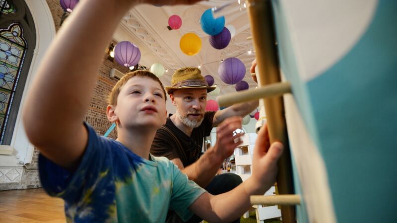 Barra and Cristoir O’Duill constructing a marble run at The Curiosity Carnival in Smock Alley, Dublin. Photograph: Alan Betson / The Irish Times