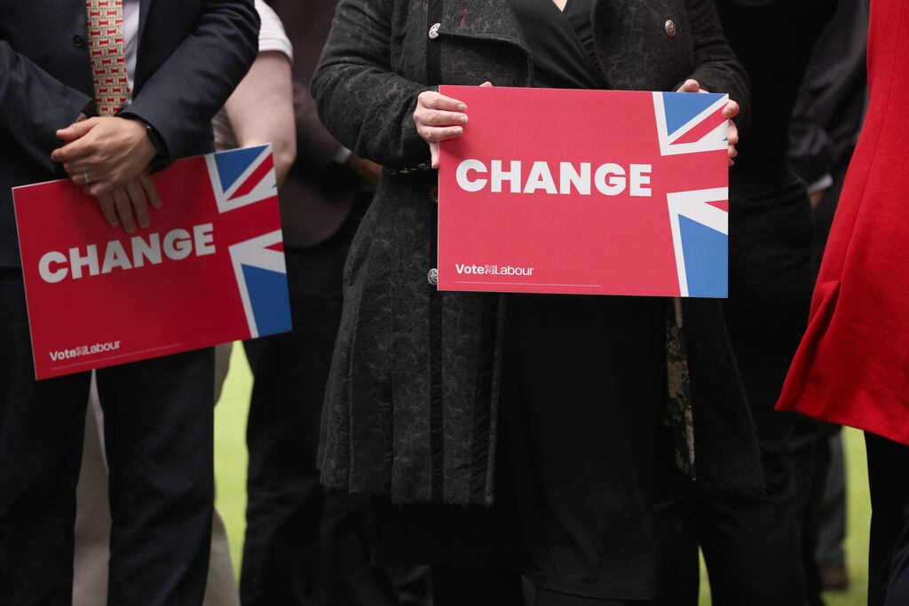 Labour supporters hold placards before Keir Starmer speaks at a campaign event at Gillingham Football Club. All eyes are on the Labour leader, who most expect will be moving into Downing Street on July 5th. Photograph: Dan Kitwood/Getty Images