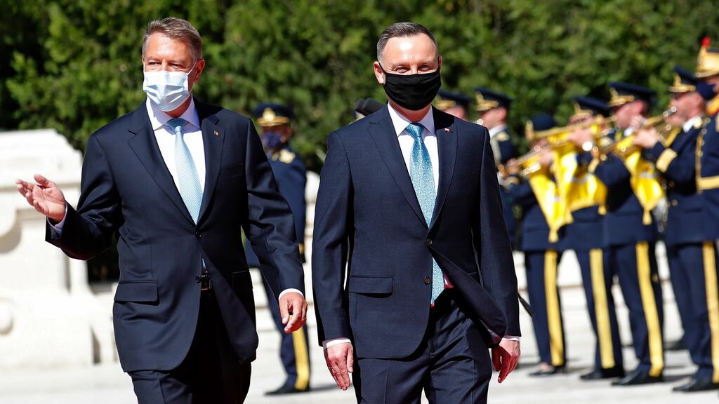 Romanian president Klaus Iohannis (left) and Polish president Andrzej Duda reviewing an honour at Cotroceni Presidential Palace in Bucharest, Romania. Photograph: EPA/Robert Ghement