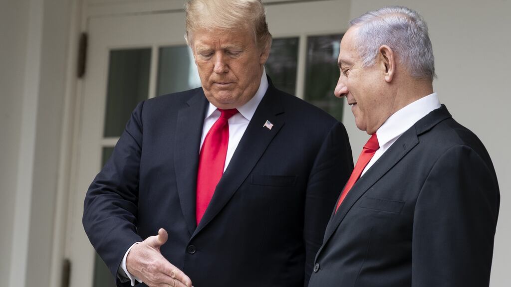 WASHINGTON, DC - MARCH 25: (L-R) U.S. President Donald Trump and Prime Minister of Israel Benjamin Netanyahu prepare to shake hands while walking through the colonnade prior to an Oval Office meeting at the White House March 25, 2019 in Washington, DC. Netanyahu is cutting short his visit to Washington due to a rocket attack in central Israel that had injured seven people. (Photo by Drew Angerer/Getty Images)