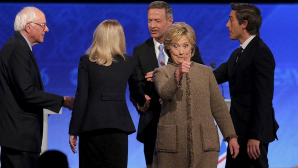Democratic U.S. presidential candidate Hillary Clinton gives a thumbs up to supporters in the crowd as Senator Bernie Sanders (left) and former Governor Martin O’Malley (3rd left) shake hands with moderators Martha Raddatz (2nd left) and David Muir (right) at the end of the the Democratic presidential candidates debate at St. Anselm College in Manchester, New Hampshire. Photograph: Brian Snyder/Reuters