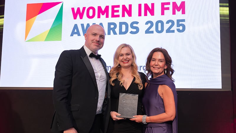 Derek O'Boyle, managing director, MKF Property Services, presents the best female led team award to Niamh Hussey and Michelle Wallace, CBRE