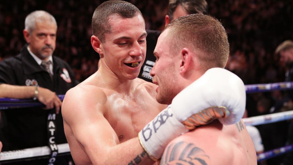 Scott Quigg and Carl Frampton embrace after their IBF & WBA World Super-Bantamweight Championship bout at Manchester Arena. Photograph: Nick Potts/PA