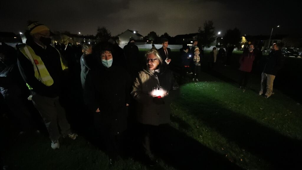 Residents of the Llewellyn estate in Ballinteer hold a candlelit vigil on Wednesday night after the bodies of Seema Banu (37) and her children Affira (11) and Fazan (6)  were discovered in their home on the estate.  Photograph: Nick Bradshaw