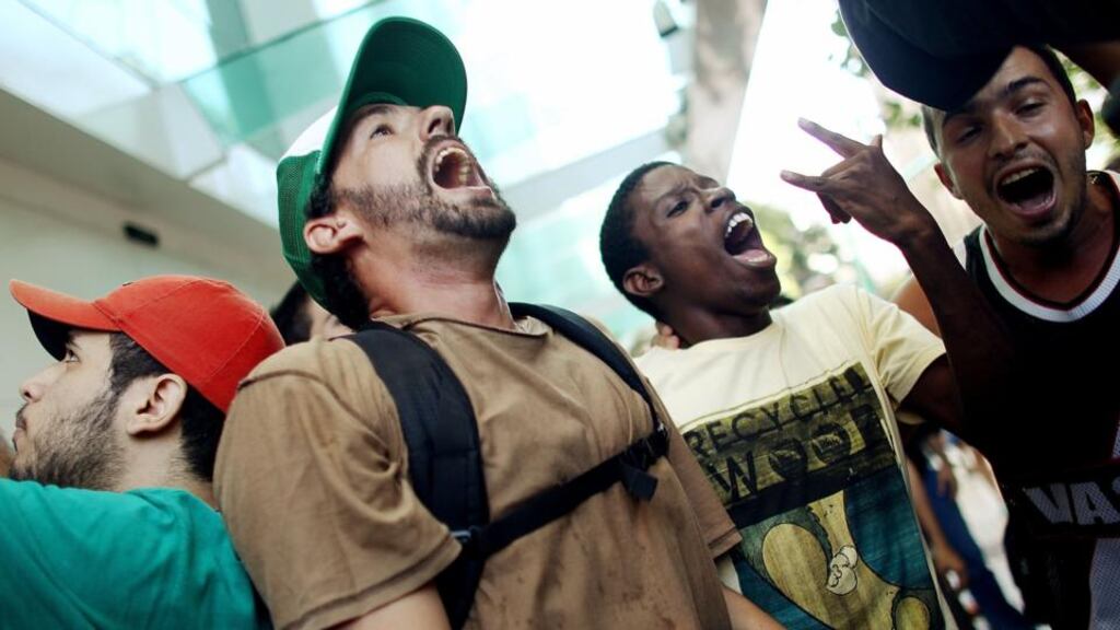 Young people chant during a rolezinho in Rio de Janeiro, Brazil. Rolezinhos are a new form of social gathering and protest at shopping centres by working-class teens in Brazil. Photograph: Mario Tama/Getty