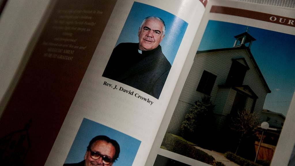 Rev John David Crowley in a church directory at Holy Angels parish. Crowley was named in a grand jury report that listed hundreds of Catholic priests in Pennsylvania accused of abusing children. Photograph: Sam Hodgson/The New York Times