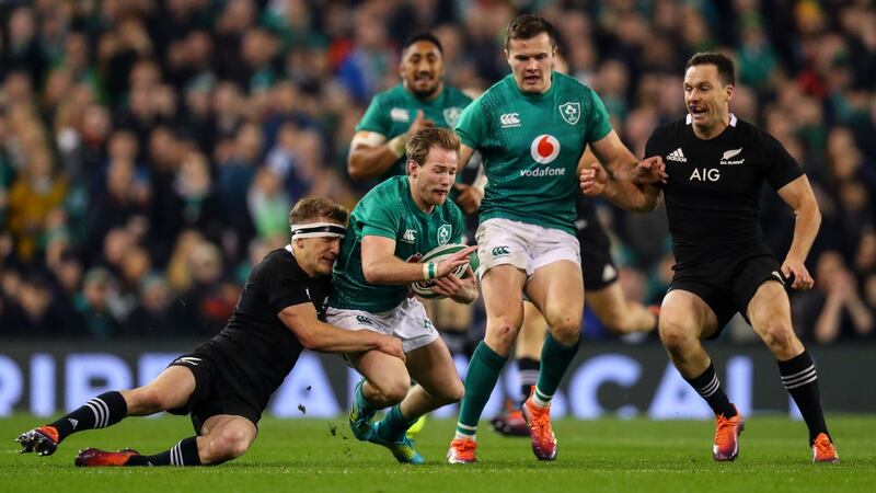 Kieran Marmion is tackled by Damian McKenzie. Photo: Oisin Keniry/Inpho