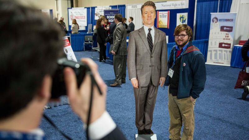 An attendee poses with a cutout of Republican Senator Rand Paul at the annual Conservative Political Action Conference in Maryland. Photograph: Drew Angerer/The New York Times