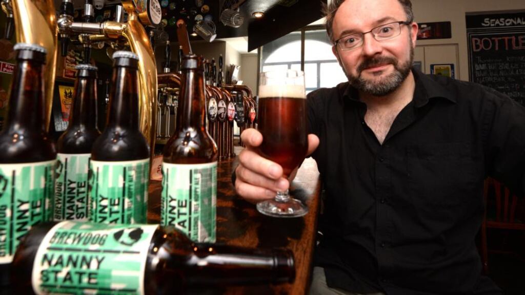 The placebo effect: Paddy Cullivan with his favourite tipple, Brewdog’s Nanny State, at the Black Sheep bar in Dublin. Photograph: Cyril Byrne