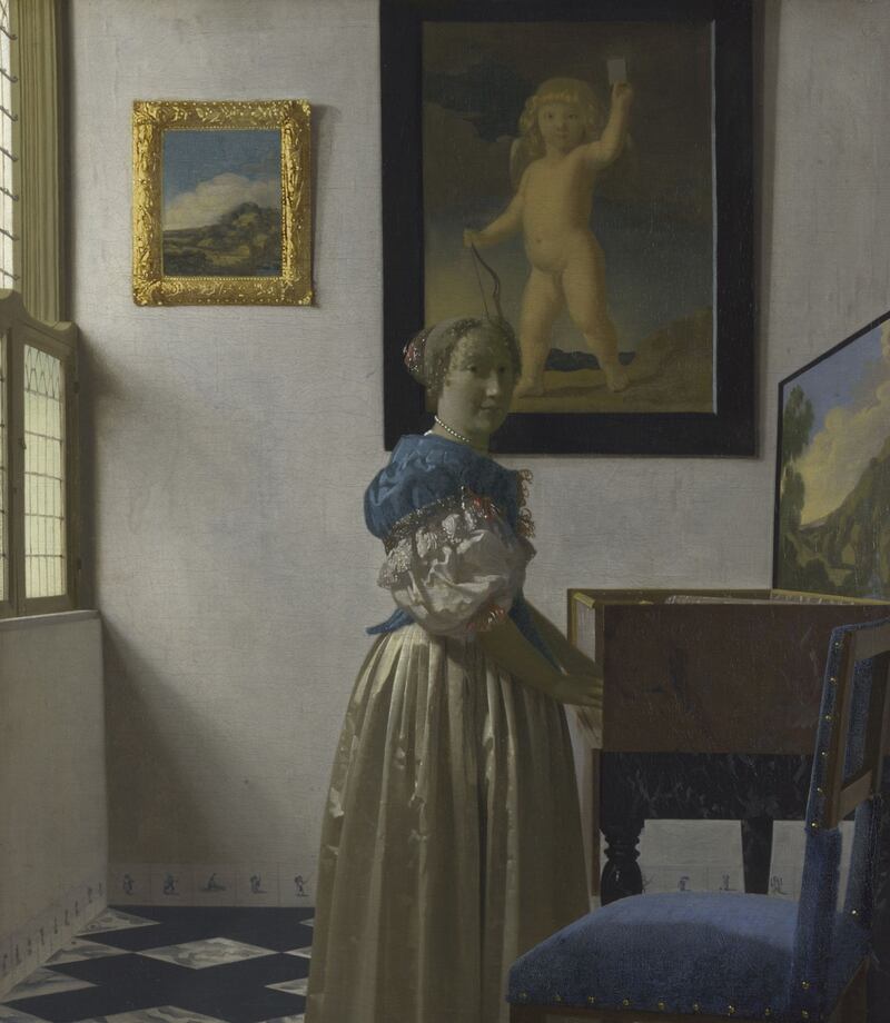 The same Cupid appears in Vermeer’s Young Woman Standing at a Virginal. Photograph: National Gallery, London