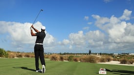 Emotional Tiger Woods shows flashes of his vintage game