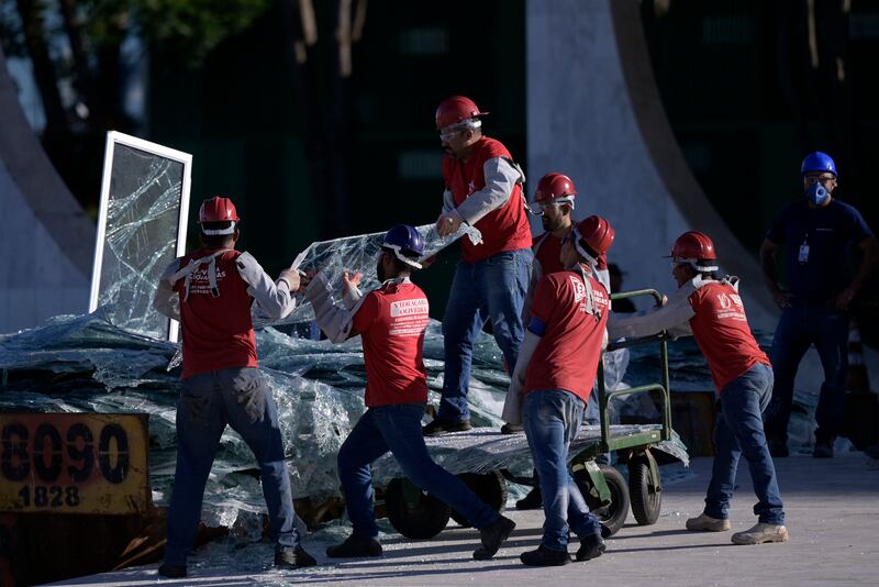 People work during the cleaning and renovation works of the Brazilian supreme court building after it was destroyed by supporters of former president Jair Bolsonaro. Photograph: Douglas Magno/AFP