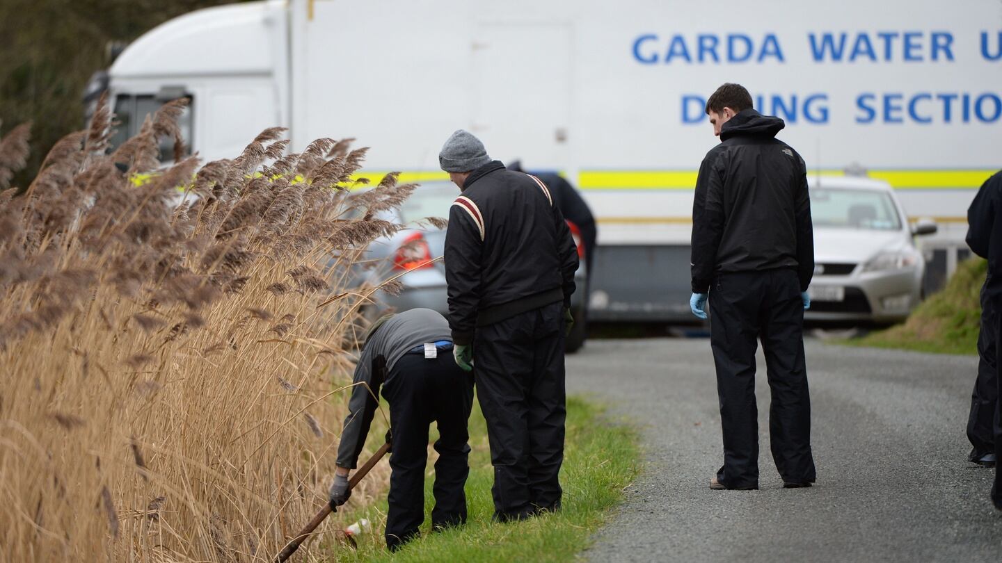 Gardaí search along the canal in Sallins, Co Kildare. Photograph: Dara Mac Dónaill/The Irish Times