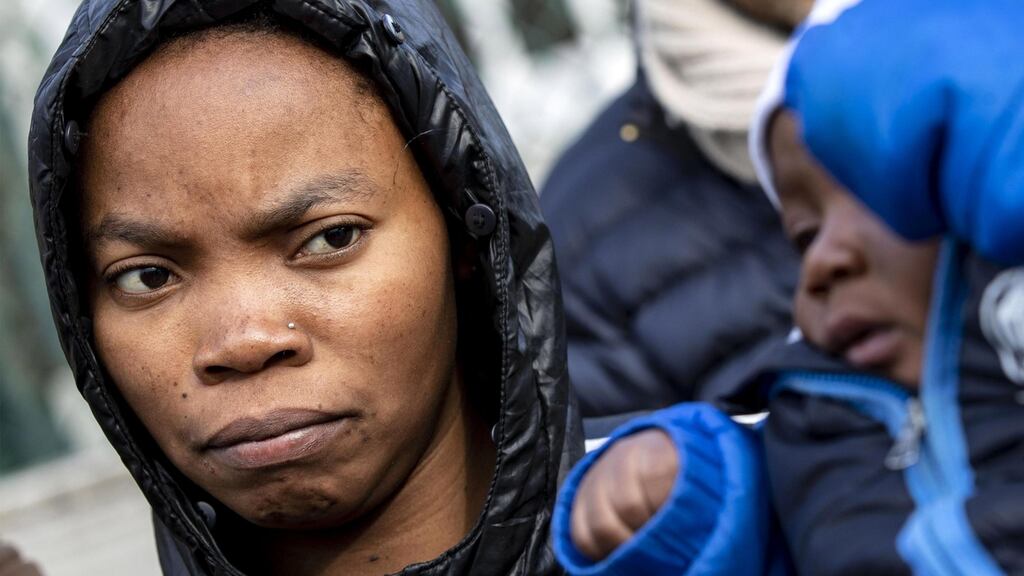 A migrant woman and child, evicted from the refugee centre at Castielnuovo di Porto. Photograph: EPA/Massimo Percossi