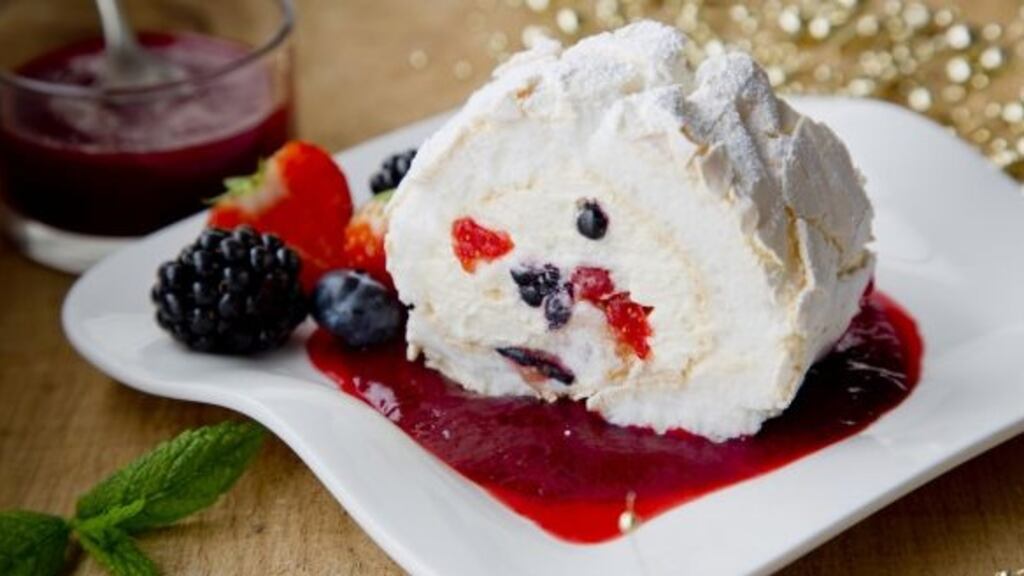 Meringue roulade with mixed berry coulis. Photograph: Harry Weir