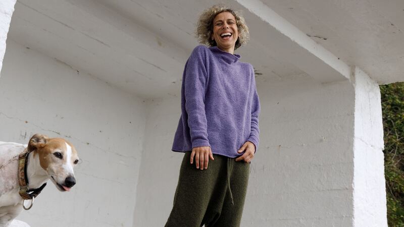 Funnel neck sweater €565, khaki trackpants €695, chunky rib socks €150, Ros Duke