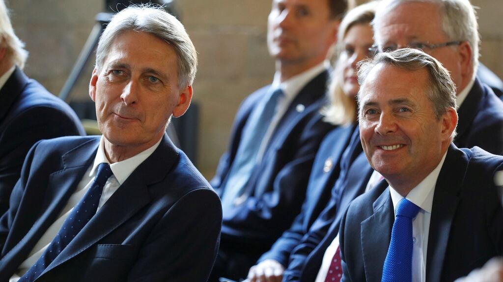 The British chancellor Philip Hammond, left, and the international trade secretary Liam Fox have jointly stated that Brexit would mean the UK pulling out of both the EU single market and the customs union. Photograph: Phil Noble/Reuters