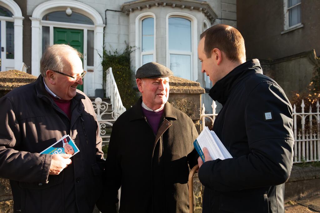 Fine Gael candidate in Waterford John Cummins (right) canvassing with his father Maurice (left), as they talk to local man Henry Flynn. Photo: Mary Browne