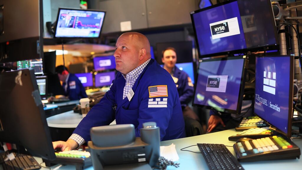 Traders work on the floor of the New York Stock Exchange. Photograph: Michael M. Santiago/Getty Images