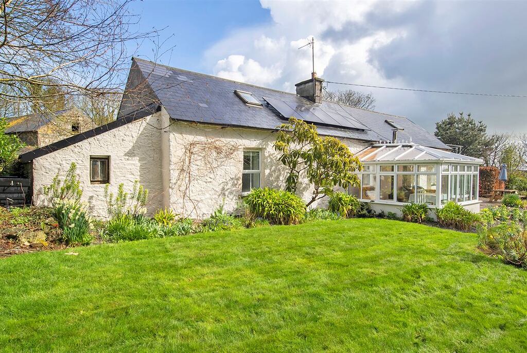 With four bedrooms and a sunny conservatory, this property sits on a generous half-acre site close to the greenway outside Dungarvan, Co Waterford.