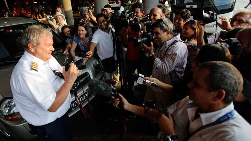 A crew member of Aeroflot’s SU150 Moscow-Havana flight takes pictures of reporters at Havana’s Jose Marti International Airport . The Aeroflot flight from Moscow that was being closely tracked by media organizations in case Edward Snowden was on board, landed in Cuba uneventfully on Monday. Photograph: Desmond Boylan/Reuters