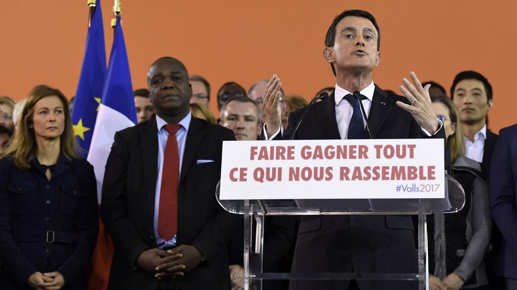 French prime minister Manuel Valls delivers a speech to announce his bid to become the Socialist presidential candidate in the 2017 presidential election, as his wife Anne Gravoin (left) listens, at the town hall of Évry, south of Paris. Photograph: Bertrand Guay/AFP/Getty Images