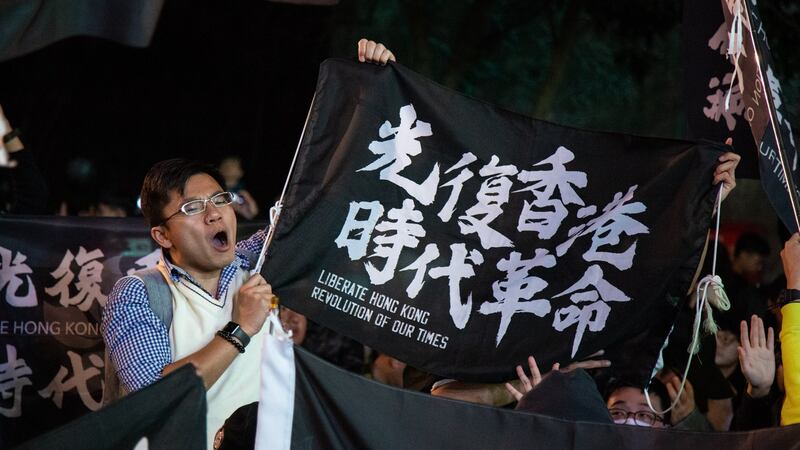 Attendees hold flags in support of Hong Kong during a Democratic Progressive Party  rally with Taiwanese President Tsai Ing-wen in Taipei, Taiwan. Photograph: Betsy Joles/Bloomberg