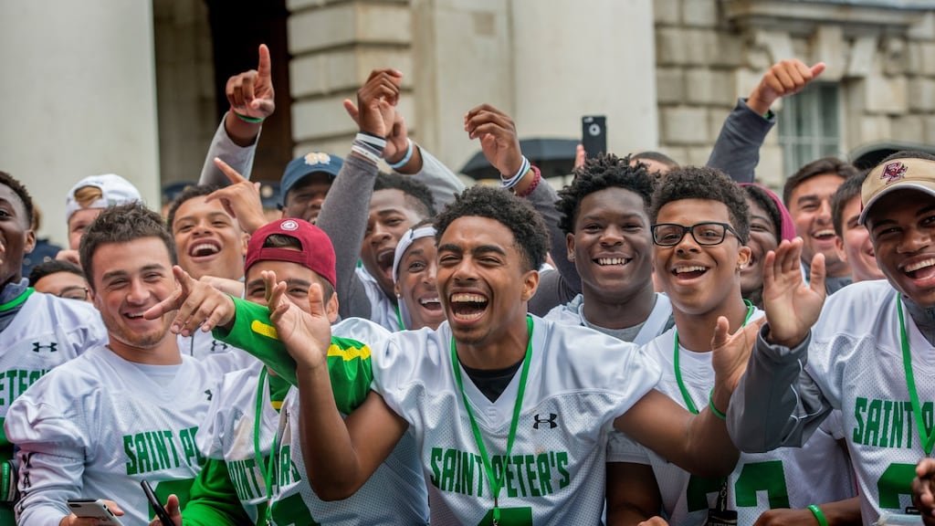 Jorge Portorreal from St Peter’s Prep School New Jersey enjoying the parade at Trinity College Dublin after they marched through Dublin as part of the American Football Showcase high school teams visit to Ireland. The high school games will be played at Donnybrook Stadium on Friday. Photograph: Brenda Fitzsimons/The Irish Times