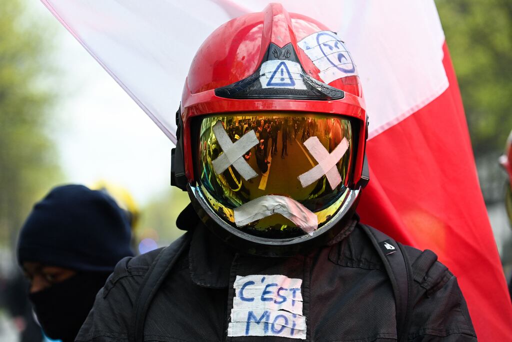 A protester in a firefighter uniform takes part in a demonstration in Paris on the 11th day of action after the French government pushed a pensions reform through parliament without a vote. Photograph: Alain Jocard/AFP via Getty Images)