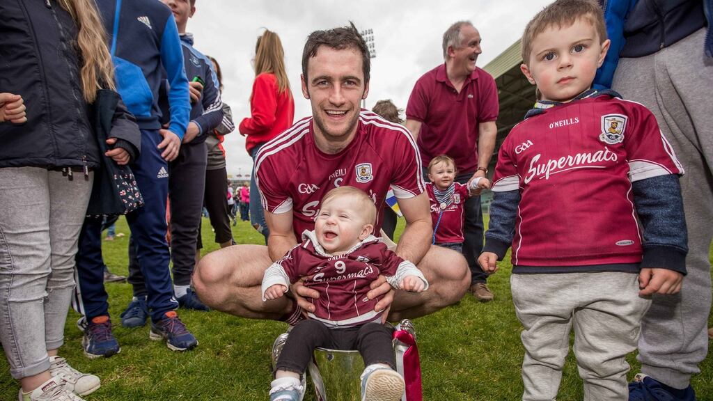 Galway captain David Burke celebrates with the Division One trophy, with his neice and nephew. Photograph: Inpho